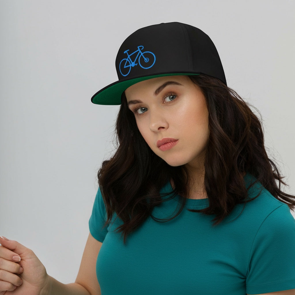 Bikes Make Me Happy high-profile black cotton snapback cap with blue bike embroidery and green undervisor on a model