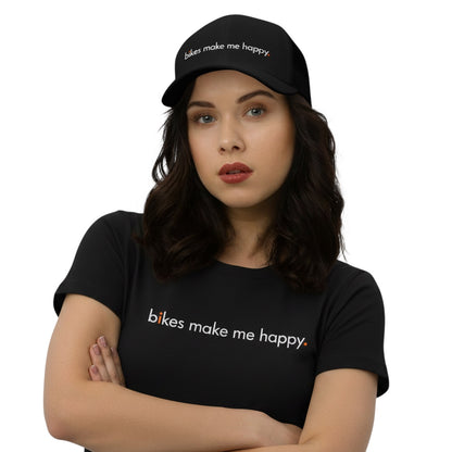 Model wearing a black Bikes Make Me Happy mid-profile six-panel hat and matching t-shirt with white text.