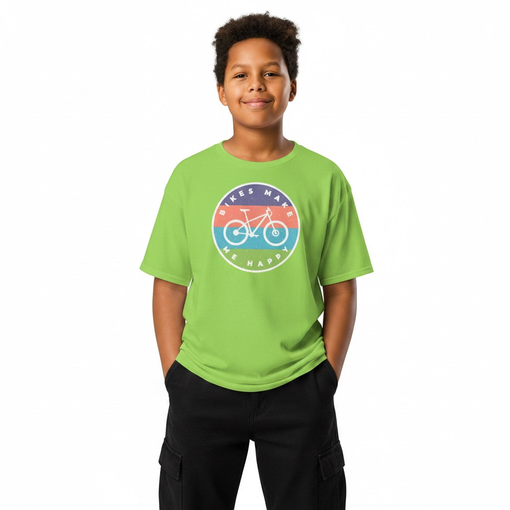 A young boy wearing a bright green Bikes Make Me Happy youth t-shirt with a circular graphic badge on the chest.