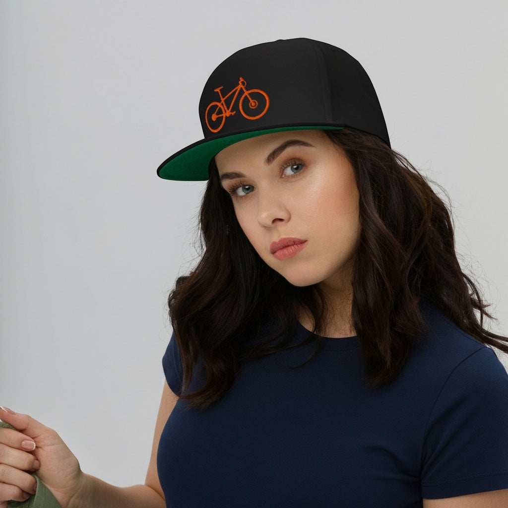 Bikes Make Me Happy high-profile black cotton snapback hat with orange mountain bike embroidery and green undervisor