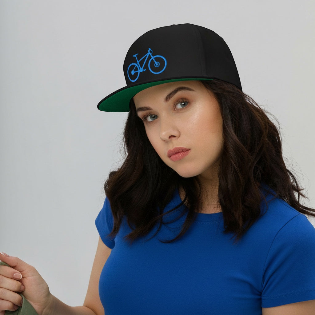 Bikes Make Me Happy high-profile black snapback hat with blue mountain bike embroidery and green undervisor on model