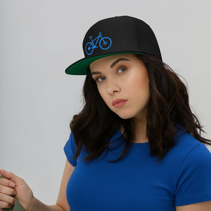 Bikes Make Me Happy high-profile black snapback hat with blue mountain bike embroidery and green undervisor on model