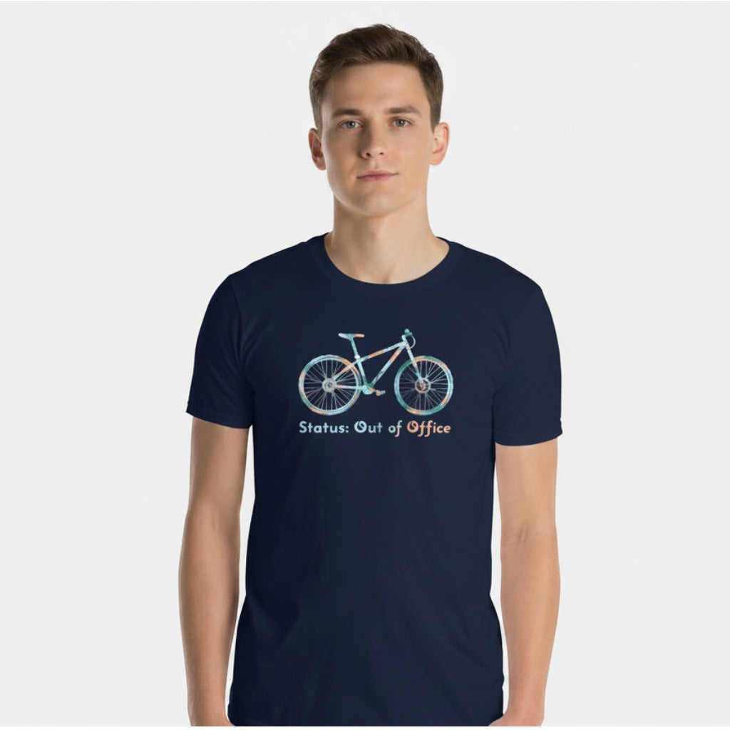 A man wearing a navy blue Bikes Make Me Happy cotton t-shirt with a mountain bike graphic and Out of Office text.