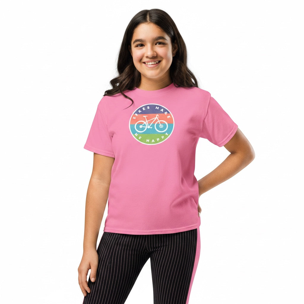 Young girl wearing a pink Bikes Make Me Happy cotton t-shirt with a circular bicycle graphic badge on the chest