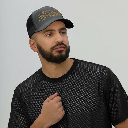 Bikes Make Me Happy mid-profile trucker hat with mountain and bike graphic worn by a man in a black mesh shirt