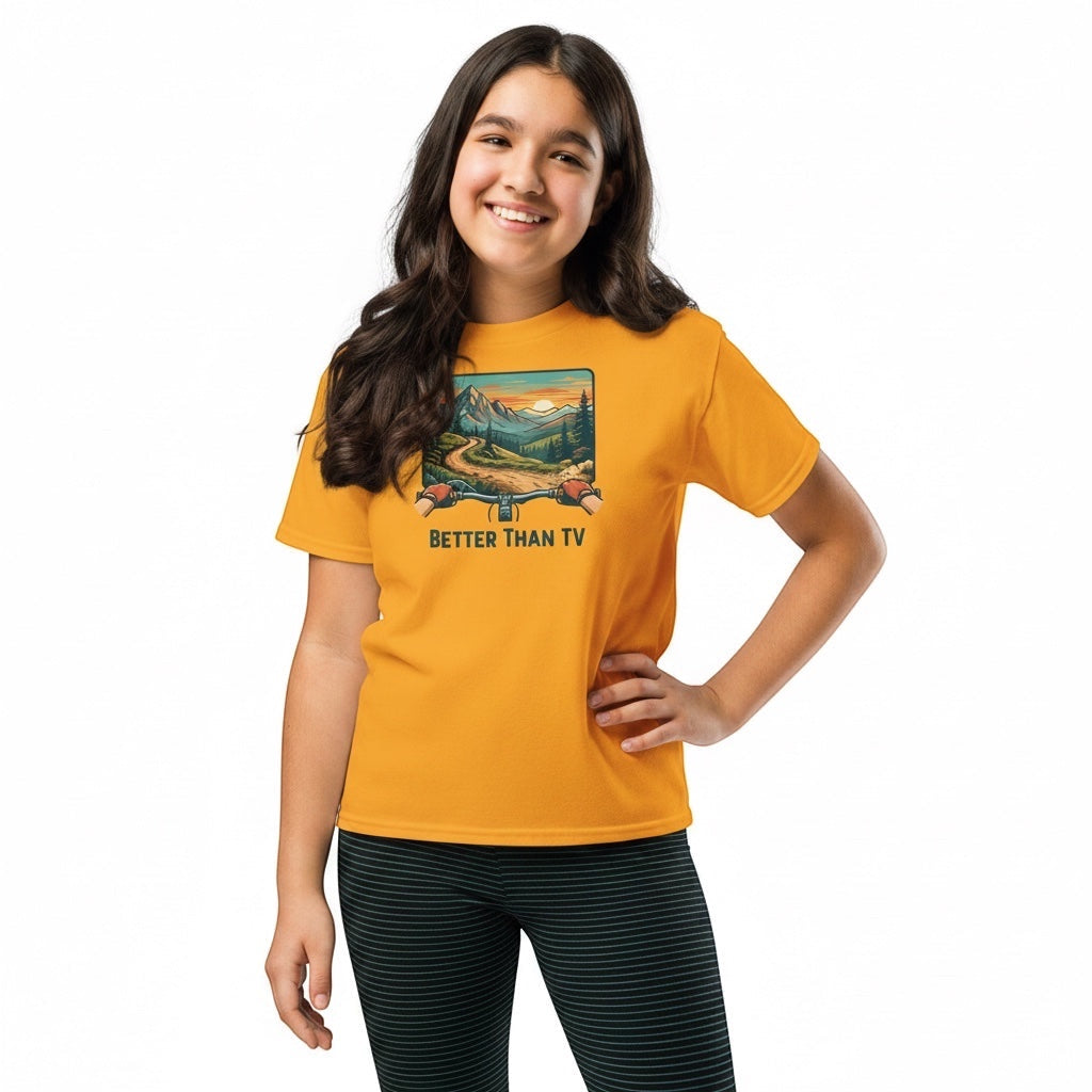 A smiling girl wearing a Bikes Make Me Happy yellow cotton t-shirt with a mountain biking graphic.