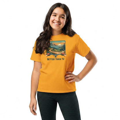 A smiling girl wearing a Bikes Make Me Happy yellow cotton t-shirt with a mountain biking graphic.