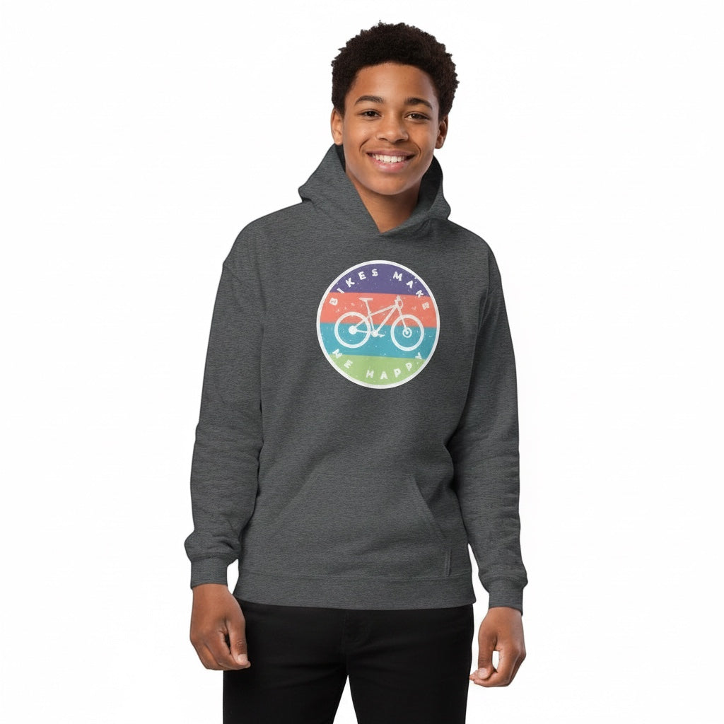 Youth wearing a Bikes Make Me Happy dark grey fleece hoodie with a colourful circular cycling badge on the chest
